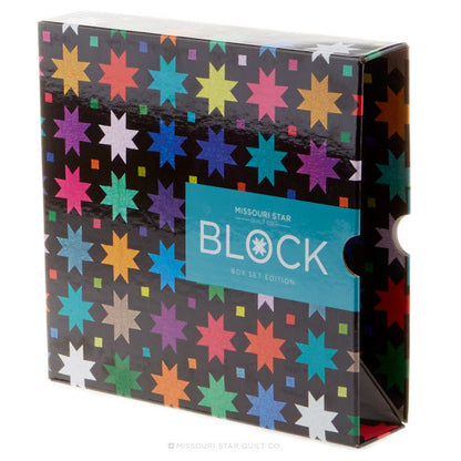 Missouri Star Guit Co. Block Box Set Edition box packaging, featuring a black background with a colorful pattern of starbursts in pink, blue, yellow, orange, green, and purple, with a teal label on the front.
[additional_image_link]
