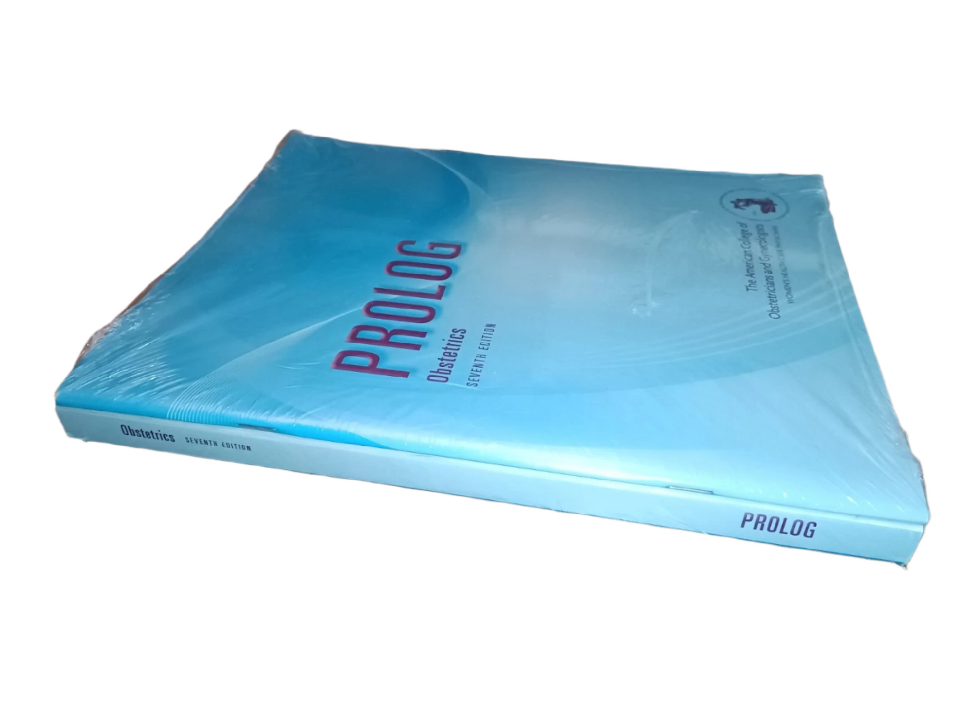 Book titled 'Prolog' on a wooden surface with other books stacked in the background.
[additional_image_link]
