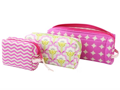 Set of three pink and white patterned pouches on a white background.
Photo by Annie [additional_image_link]