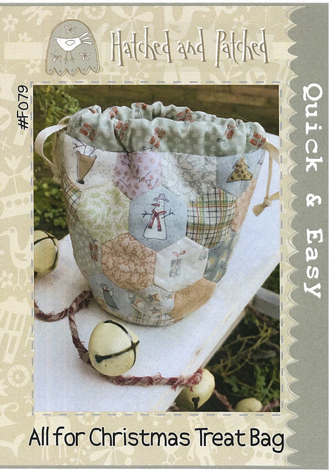 Quilted treat bag with Christmas design on a white surface, featuring the brand 'Hatched and Patched'.
Photo by Hatched and Patched [image_link]