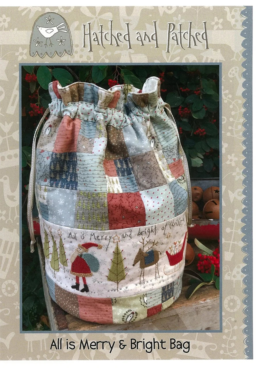 Patchwork drawstring bag with festive design on a textured background.
Photo by Hatched and Patched [image_link]
