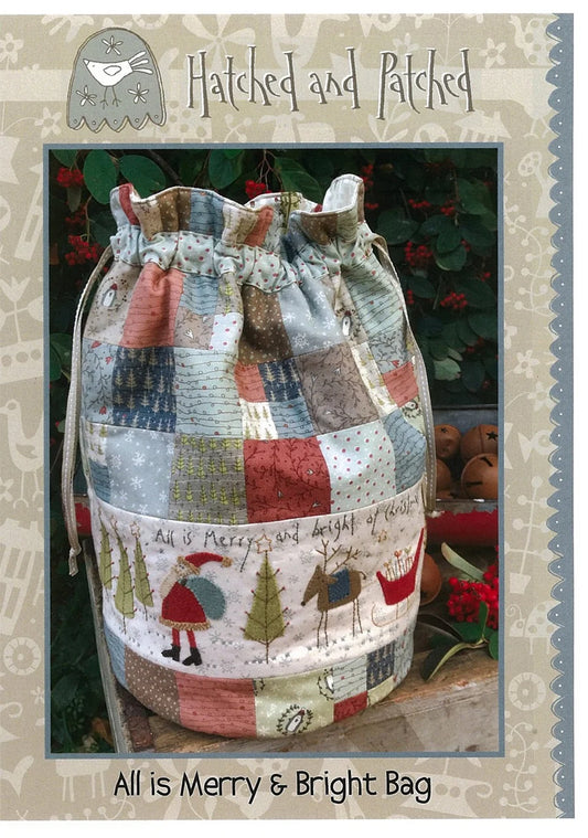 Patchwork drawstring bag with festive design on a textured background.
Photo by Hatched and Patched [image_link]