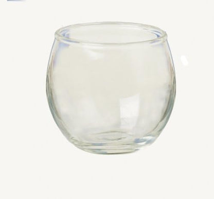 A clear glass votive with a rounded, bulbous shape, shown on a plain off-white background.
[additional_image_link]