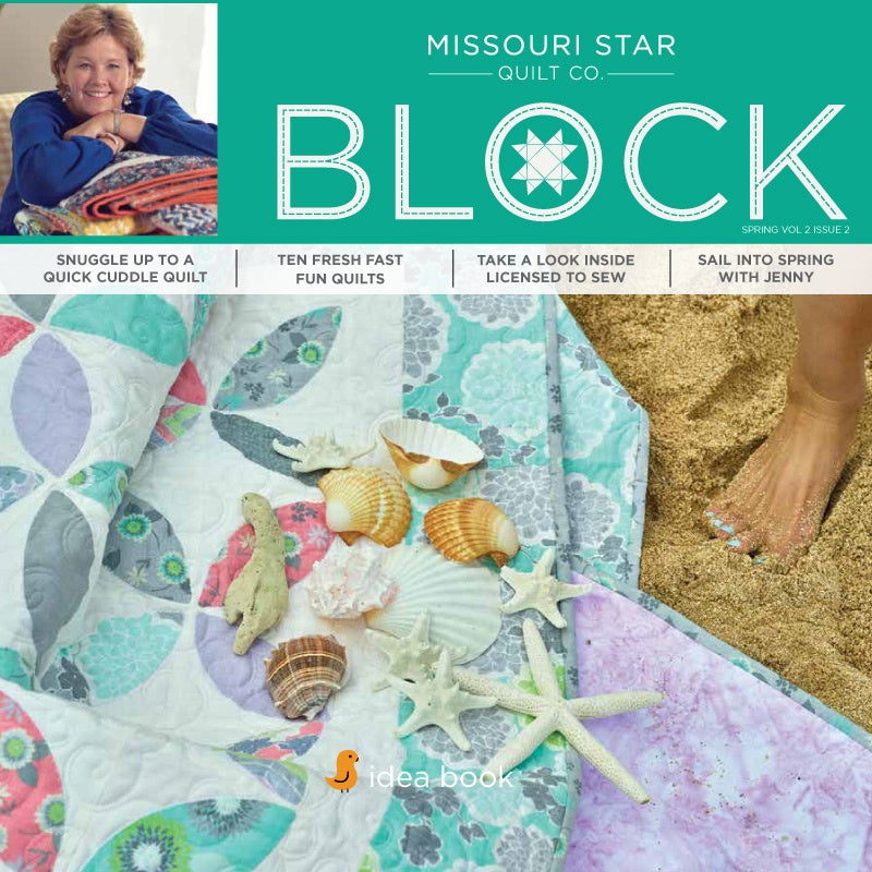 Front cover of the Missouri Star Quilt Co. 'Block' spring quilt pattern book, featuring a teal header with white text and a collage of colorful patchwork quilts styled with seashells on sand and fabric. Spring Volume 2 Issue 2.
[additional_image_link]