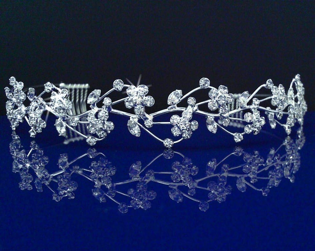 Silver tiara with floral design on a reflective blue surface
[image_link]