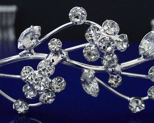 Silver tiara with crystal stones on a dark background
[additional_image_link]
