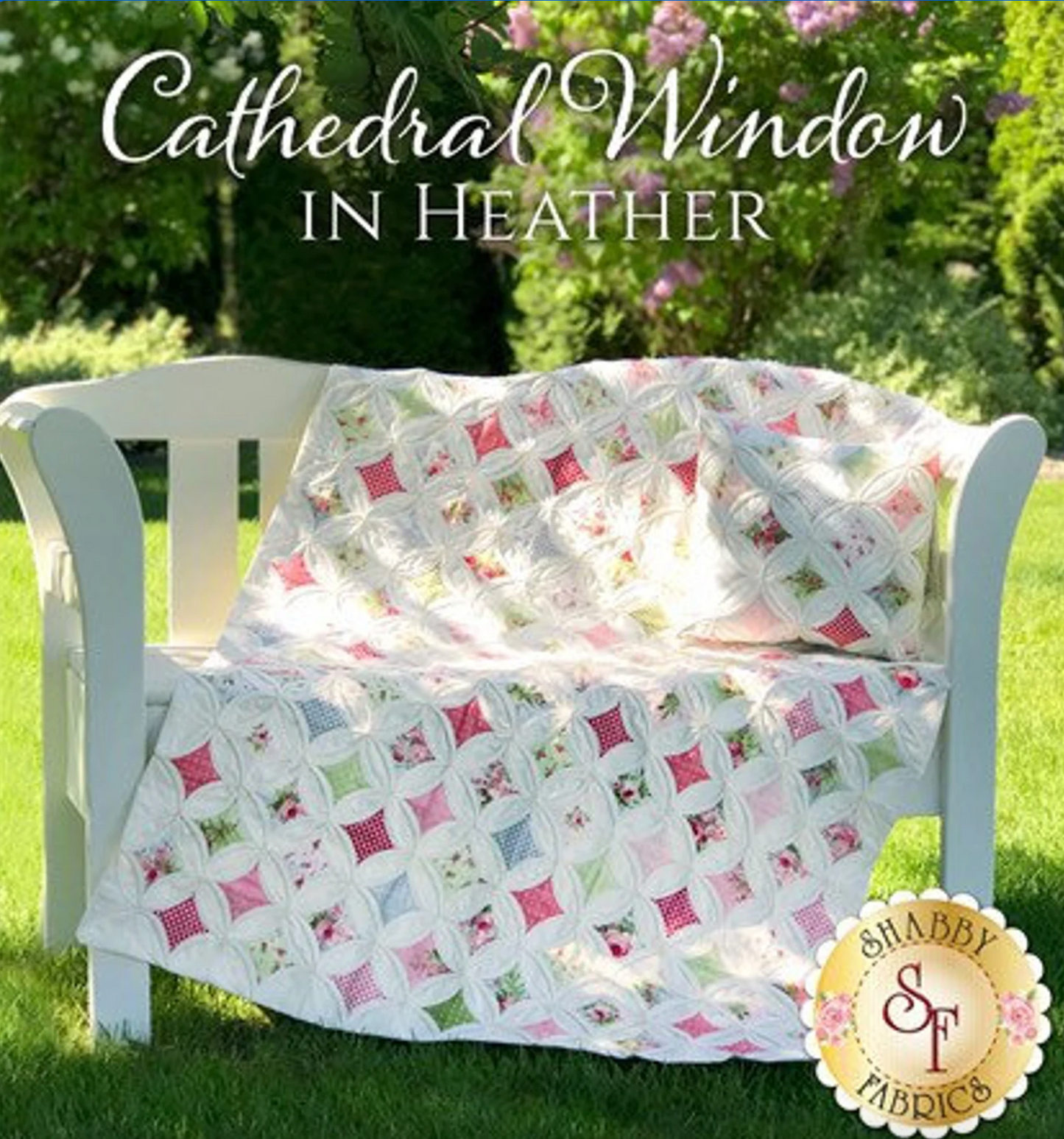 A quilt and pillow set featuring a cathedral window pattern with multicolored patches, showcased on a white chair outdoors. The product image includes the brand name 'Shabby Fabrics' and the website address.
Photo by Shabby Fabrics [additional_image_link]