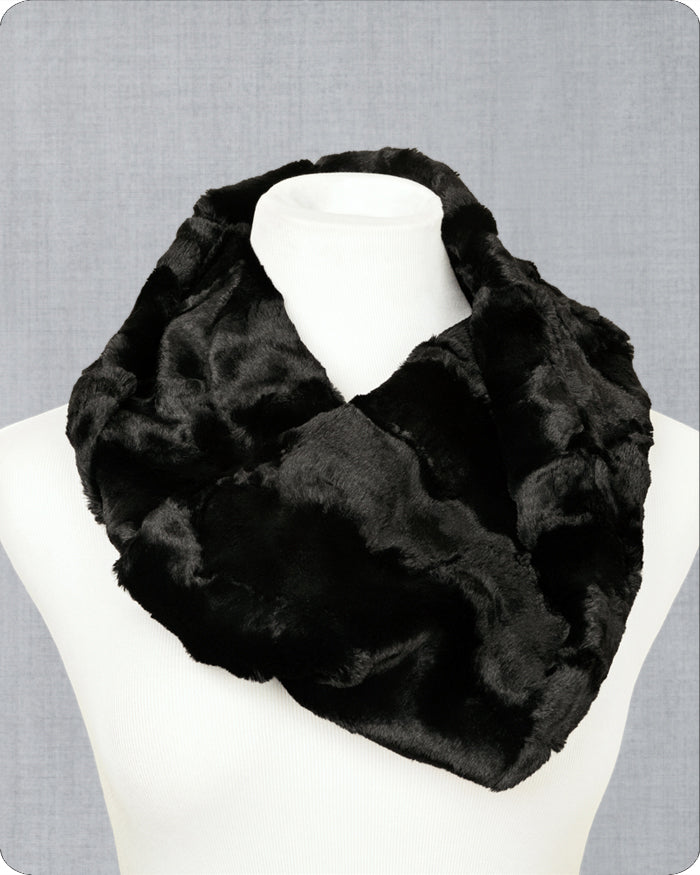 Black fur infinity scarf on a mannequin against a gray background.
Photo by Shannon Fabrics [image_link]