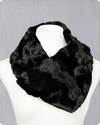 Black fur infinity scarf on a mannequin against a gray background.
Photo by Shannon Fabrics [image_link]