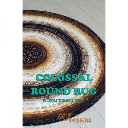 A colossal round rug with a jelly roll pattern in the center, surrounded by solid color stripes. The background is white, and the text 'COLOSSAL ROUND RUG'.
Photo by R.J .Designs [image_link]