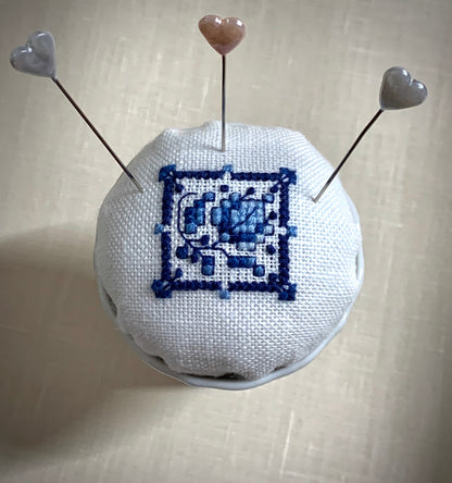 Hand stitched Delft pincushion in a vintage blue Danube double egg cup on white linen, with a signature pattern by Blue Danube in Japan.
Photos by The Surgeon's Knots [additional_image_link]