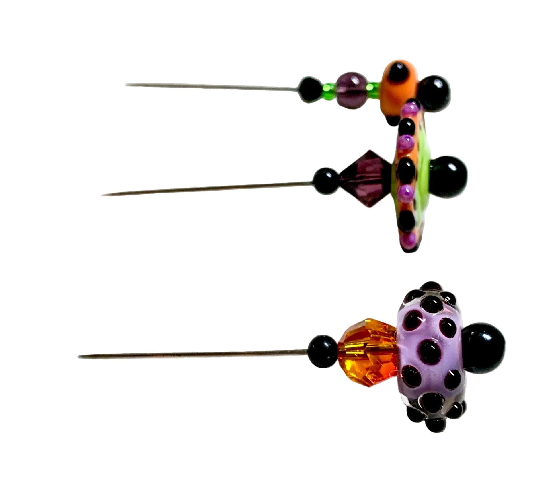 Three decorative sewing pins with colorful beaded details, displayed on a white surface.
[additional_image_link]