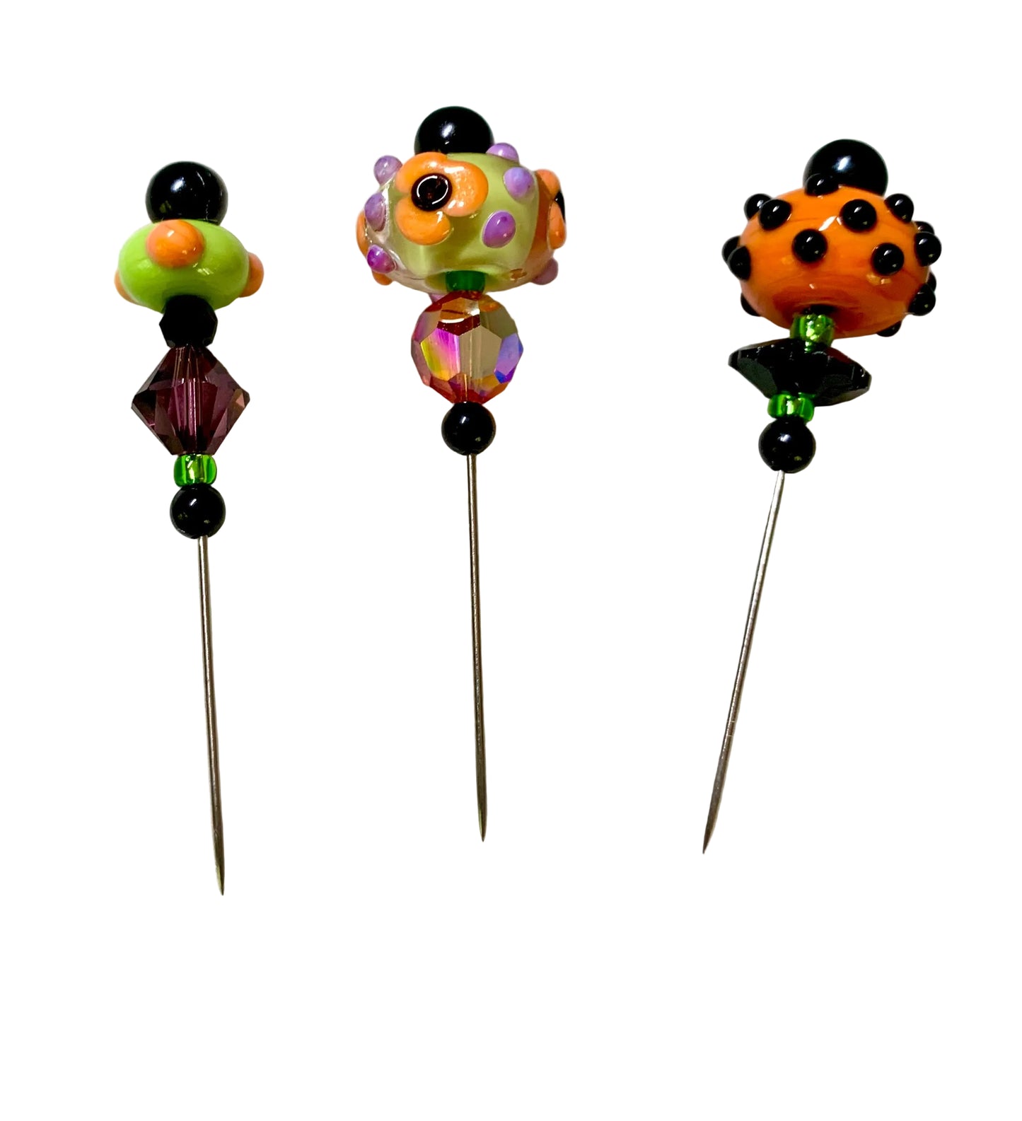 3 Decorative Halloween purple orange black green chacha pins with colorful glass beads on a white background. 
[additional_image_link]