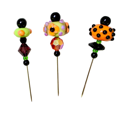 3 Decorative Halloween purple orange black green chacha pins with colorful glass beads on a white background. 
[additional_image_link]