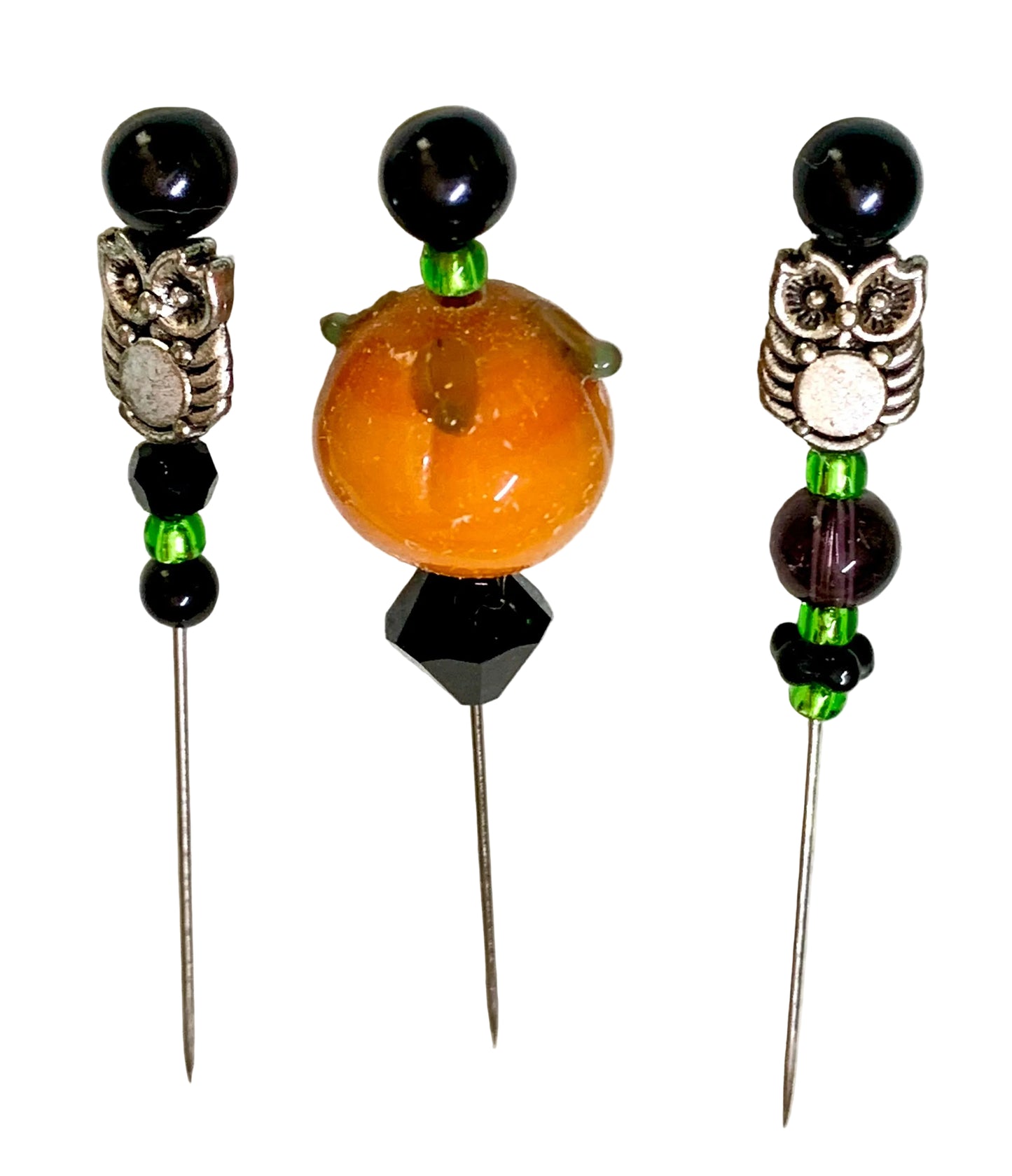 Three decorative sewing pins with owl and pumpkin bead embellishments, displayed on a white background.
[additional_image_link]