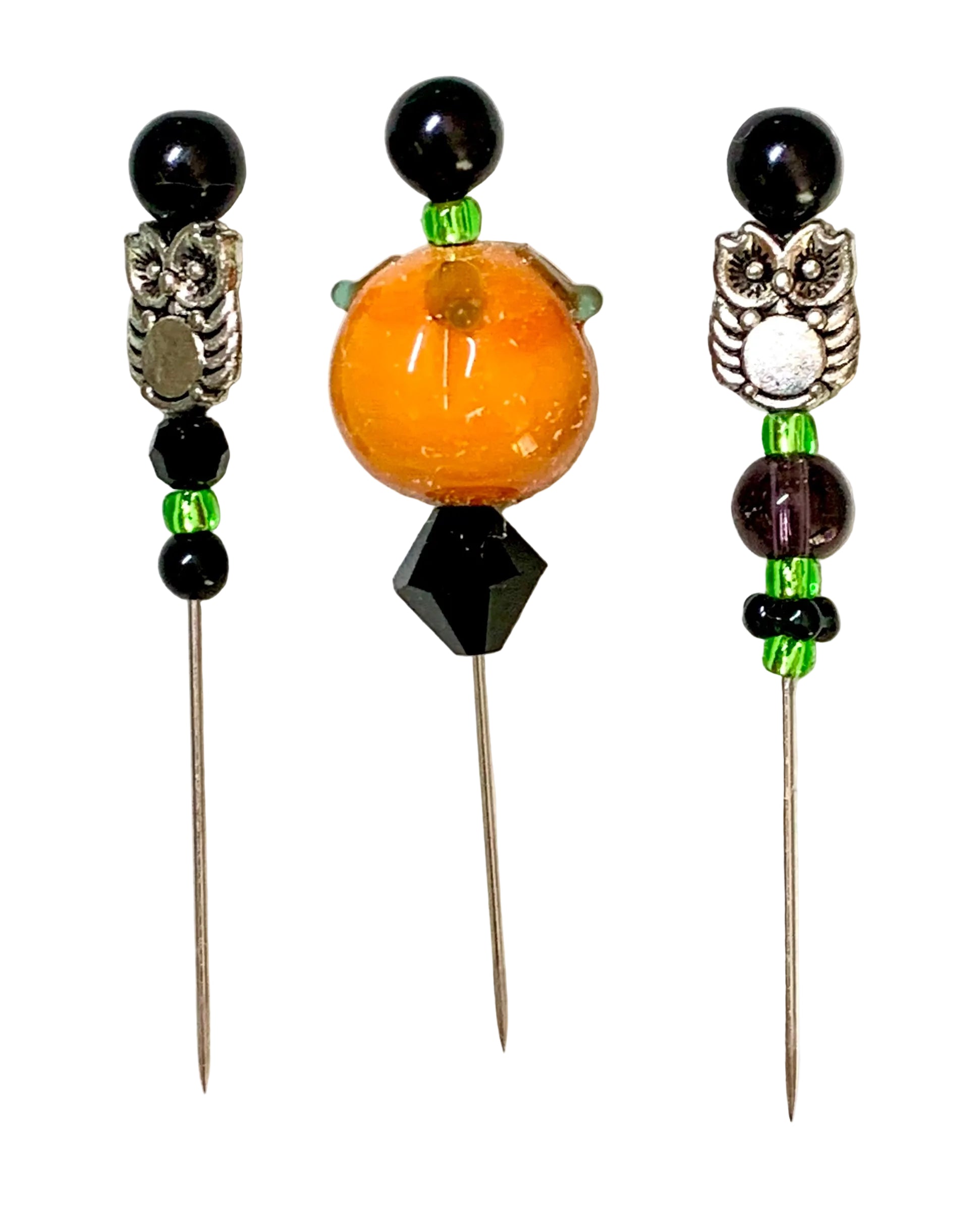 Three beaded sewing pins with owl charms and metallic pins, displayed on a textured white background.
[image_link]