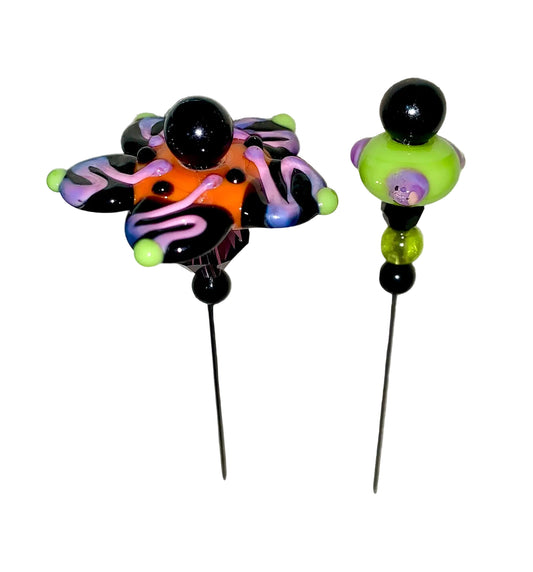 2 Decorative Halloween purple orange black green flower pins with colorful glass beads on a white background. 
[image_link]