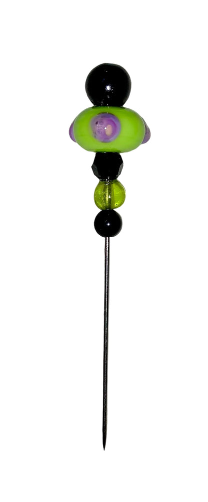 Decorative Halloween purple orange black green flower pin with colorful glass beads on a white background. 
[additional_image_link]