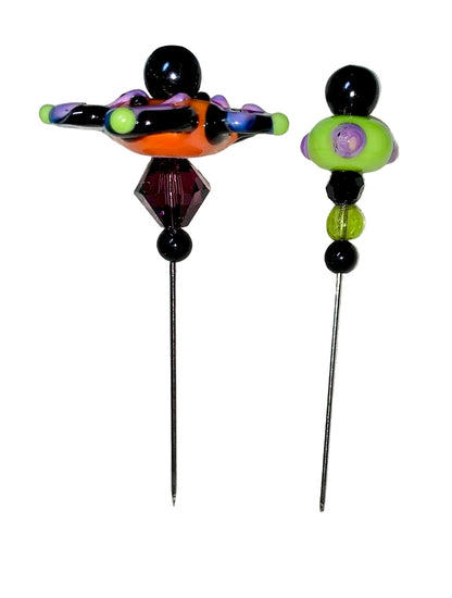 2 Decorative Halloween purple orange black green flower pins with colorful glass beads on a white background. 
[additional_image_link]