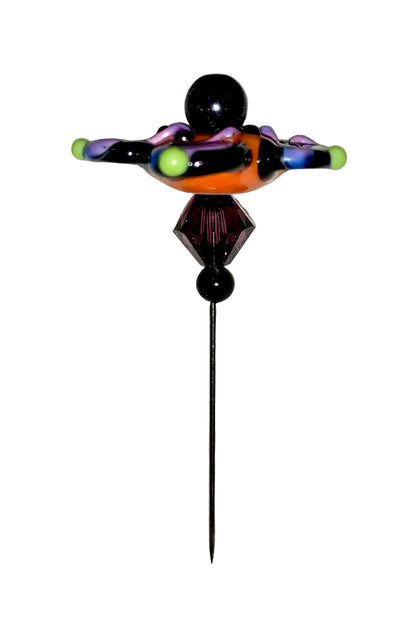 Decorative Halloween purple orange black green flower pin with colorful glass beads on a white background. 
[additional_image_link]