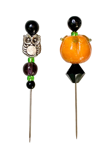 Two Halloween-themed beaded pins on a white background. One pin features a silver owl with black and green beads. The other pin is a pumpkin.
[image_link]