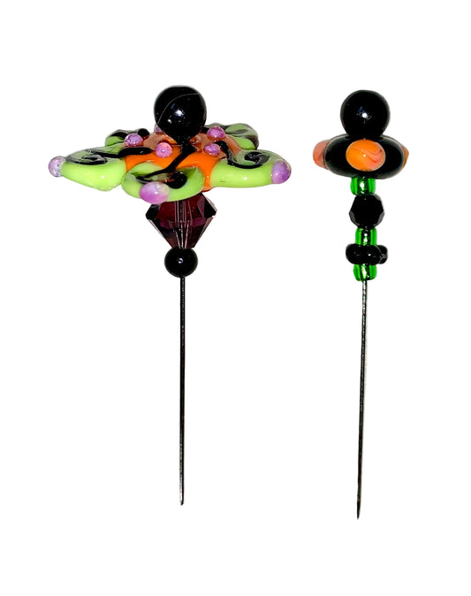 2 Decorative Halloween purple orange black green flower pins with colorful glass beads on a white background. 
[image_link]