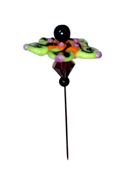Decorative Halloween purple orange black green flower pin with colorful glass beads on a white background. 
[additional_image_link]