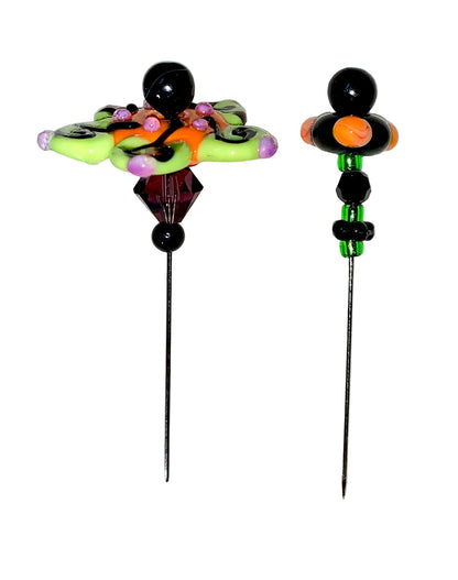 2 Decorative Halloween purple orange black green flower pins with colorful glass beads on a white background. 
[additional_image_link]