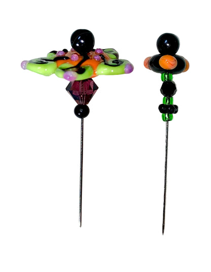 2 Decorative Halloween purple orange black green flower pins with colorful glass beads on a white background. 
[additional_image_link]
