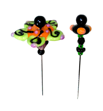 2 Decorative Halloween purple orange black green flower pins with colorful glass beads on a white background. 
[additional_image_link]