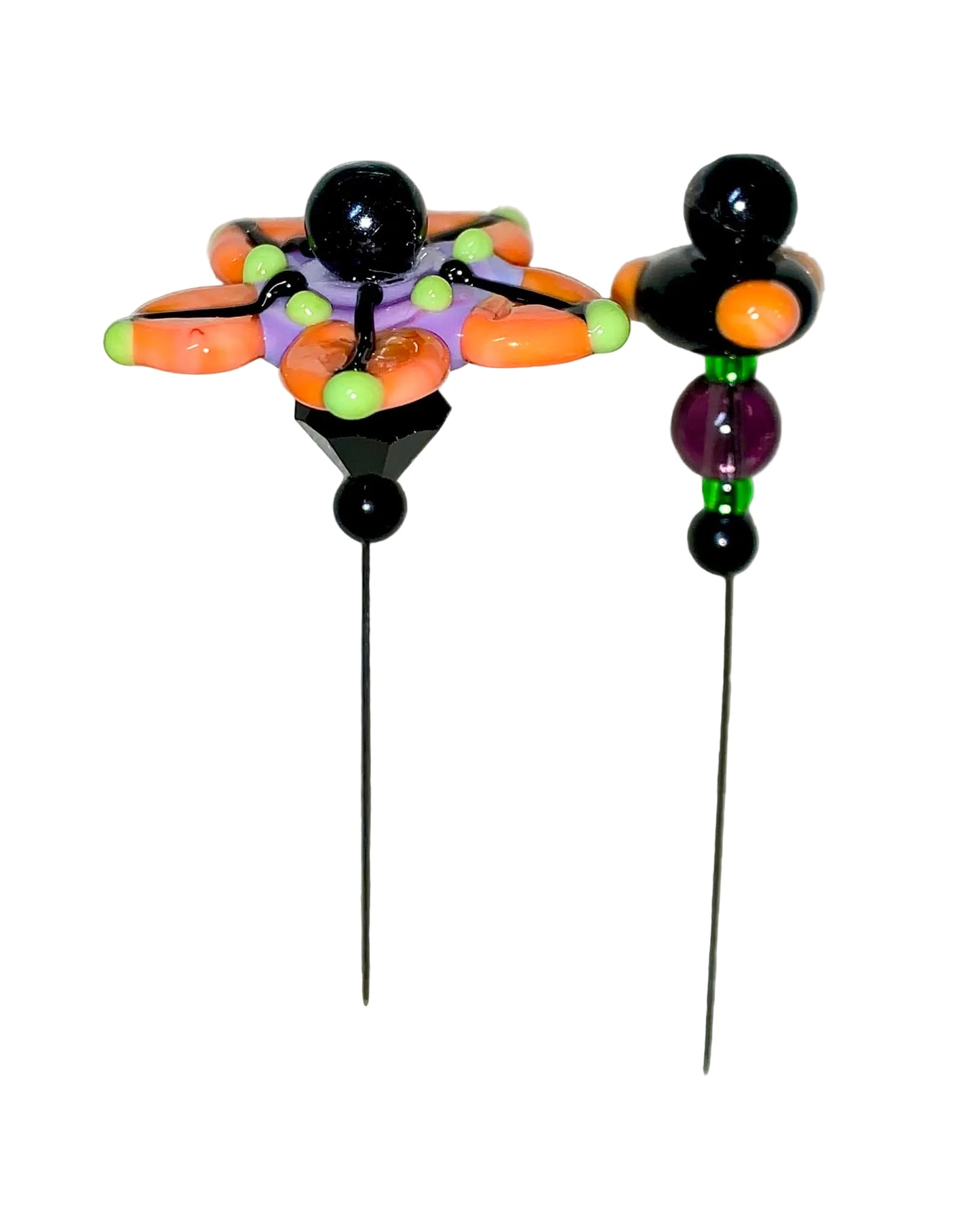 2 Decorative Halloween purple orange black green flower pins with colorful glass beads on a white background. 
[image_link]