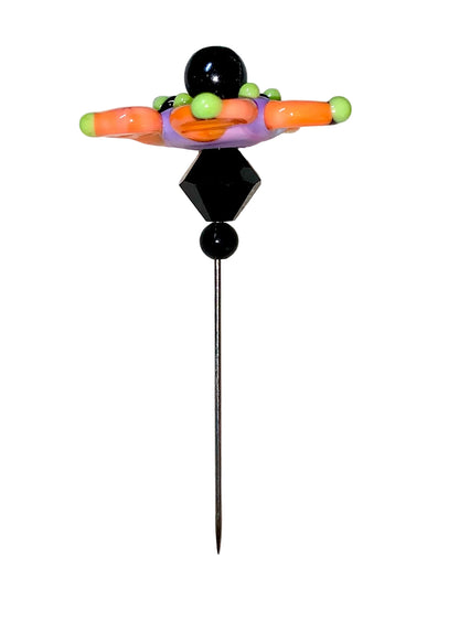 Decorative Halloween purple orange black green flower pin with colorful glass beads on a white background. 
[additional_image_link]