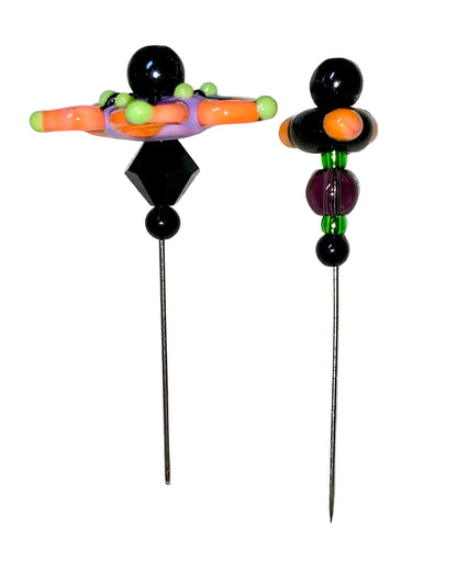2 Decorative Halloween purple orange black green flower pins with colorful glass beads on a white background. 
[additional_image_link]