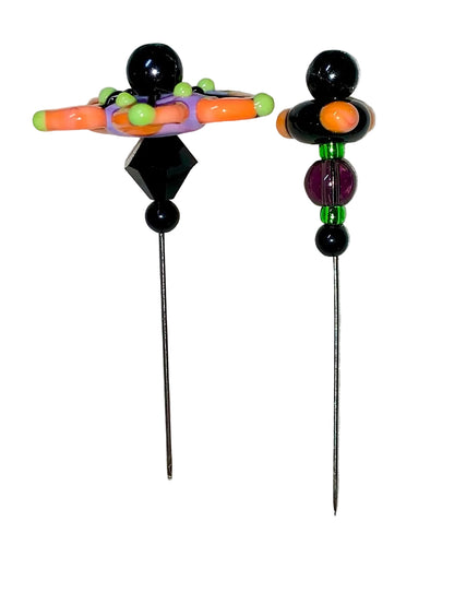 2 Decorative Halloween purple orange black green flower pins with colorful glass beads on a white background. 
[additional_image_link]