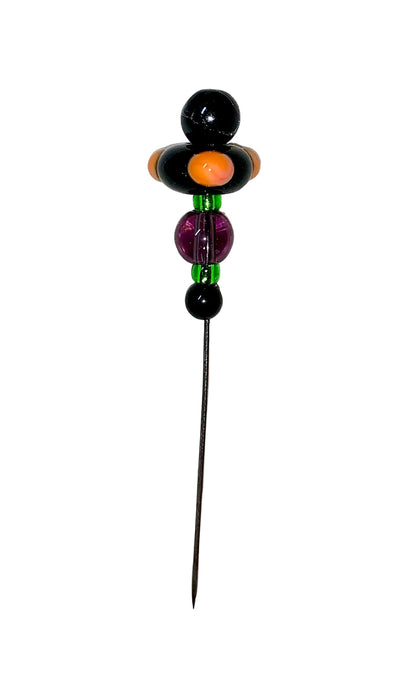 Decorative Halloween purple orange black green flower pin with colorful glass beads on a white background. 
[additional_image_link]