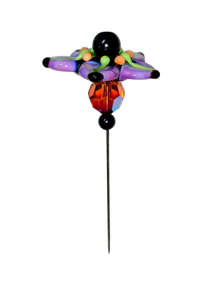 Decorative Halloween purple orange black green flower pin with colorful glass beads on a white background. 
[image_link]