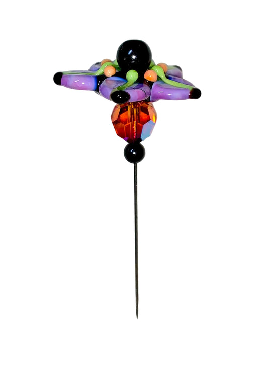 Decorative Halloween purple orange black green flower pin with colorful glass beads on a white background. 
[image_link]