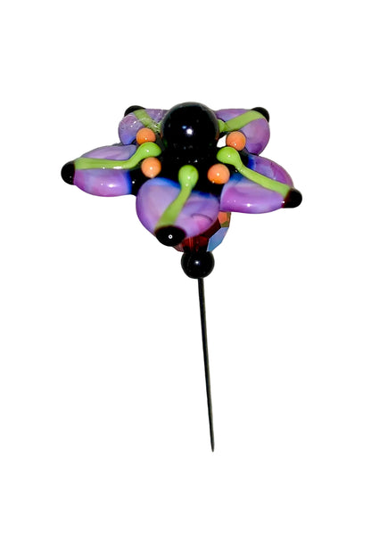 Decorative Halloween purple orange black green flower pin with colorful glass beads on a white background. 
[additional_image_link]