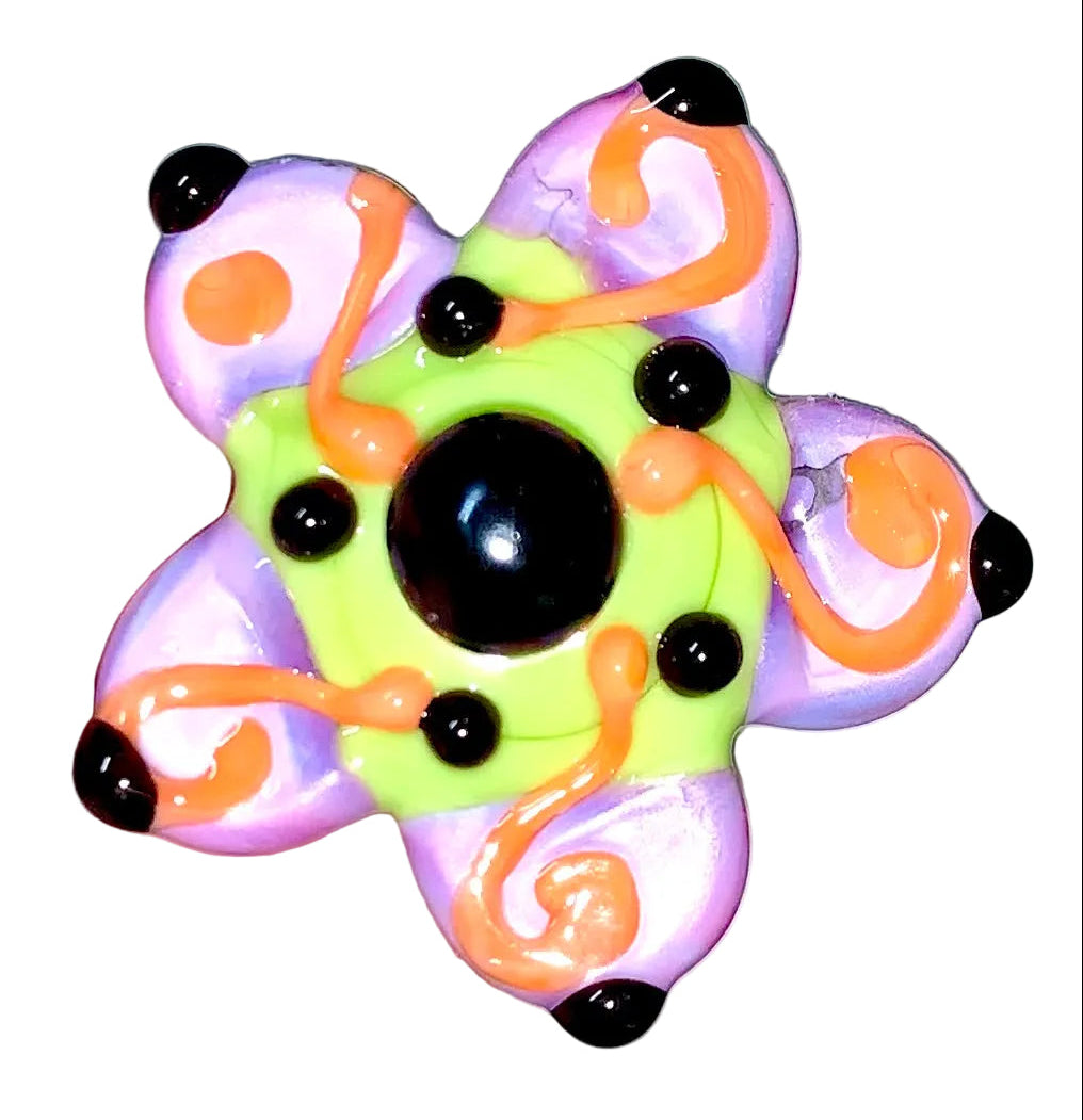 Decorative Halloween purple orange black green flower pin with colorful glass beads on a white background. 
[additional_image_link]