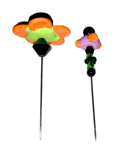 2 Decorative Halloween purple orange black green flower pins with colorful glass beads on a white background. 
[additional_image_link]