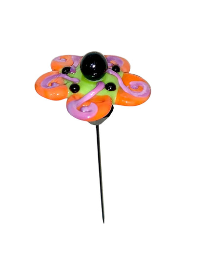 Decorative Halloween purple orange black green flower pin with colorful glass beads on a white background. 
[additional_image_link]
