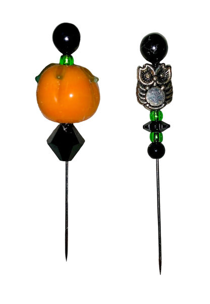 Two decorative  Halloween pins with pumpkin, owl, several green and black glass beads designs on a white background.
[image_link]