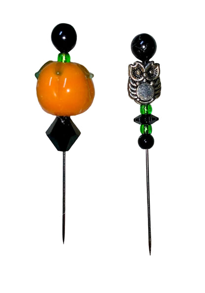 Two decorative  Halloween pins with pumpkin, owl, several green and black glass beads designs on a white background.
[additional_image_link]