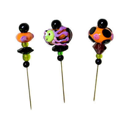 3 Decorative Halloween purple orange black green chacha pins with colorful glass beads on a white background. 
[image_link]
