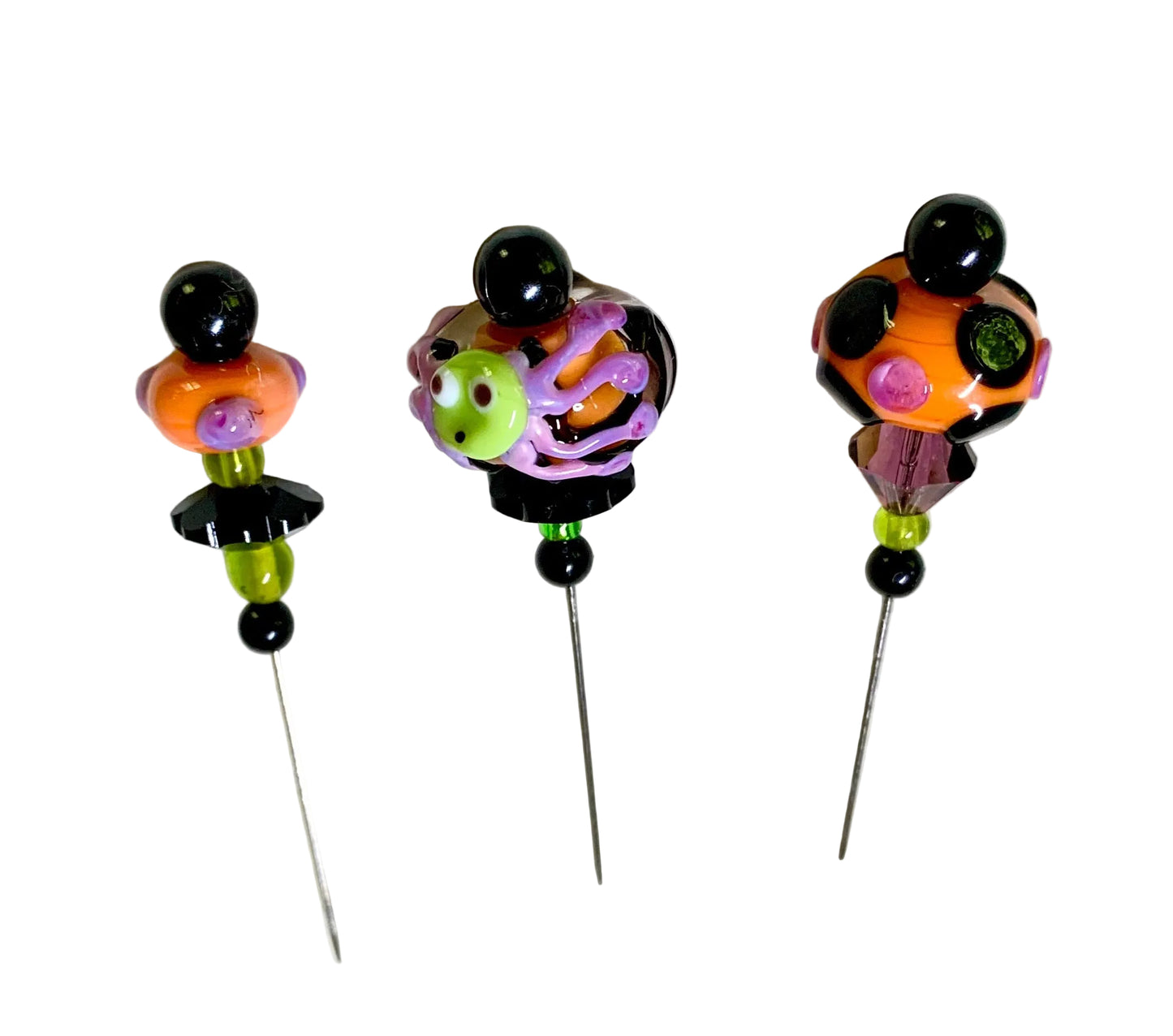 3 Decorative Halloween purple orange black green chacha pins with colorful glass beads on a white background. 
[additional_image_link]