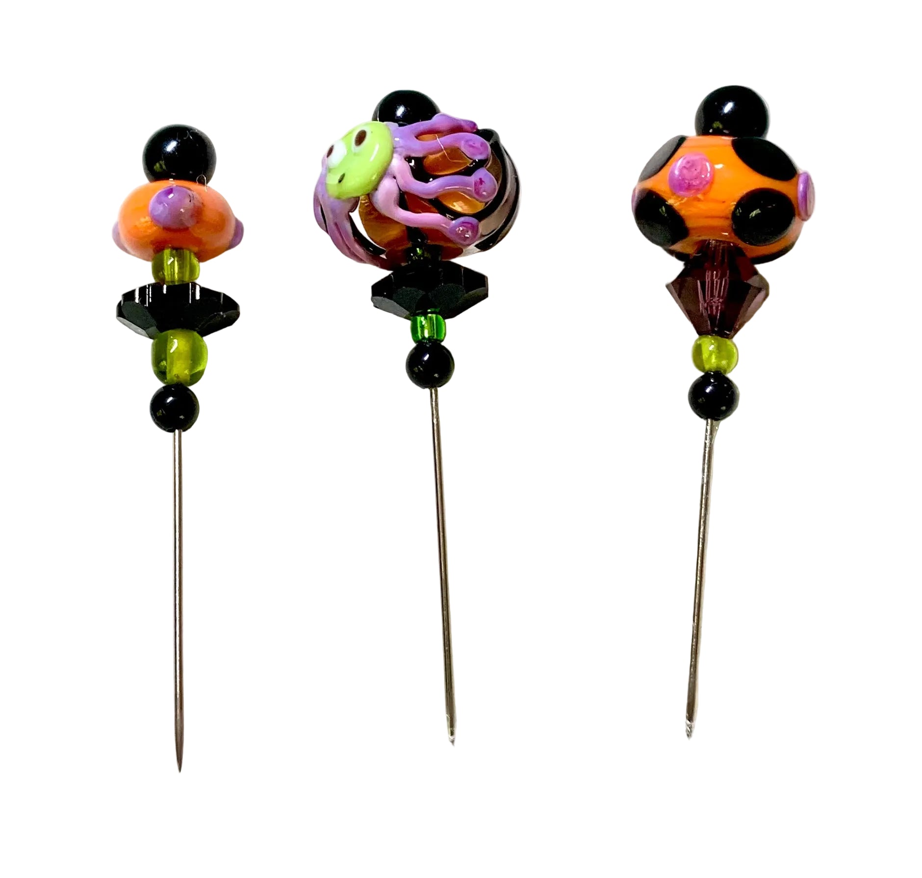 3 Decorative Halloween purple orange black green chacha pins with colorful glass beads on a white background. 
[additional_image_link]