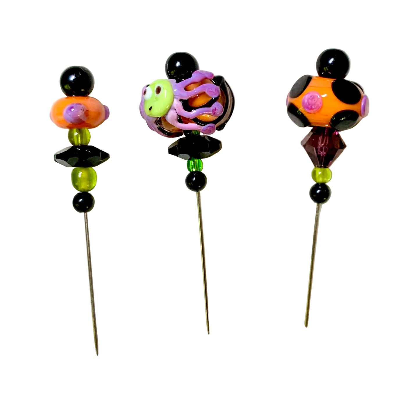 3 Decorative Halloween purple orange black green chacha pins with colorful glass beads on a white background. 
[additional_image_link]