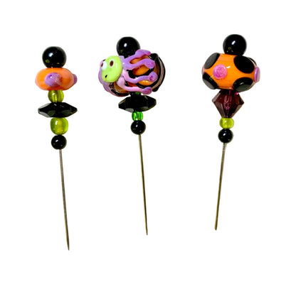3 Decorative Halloween purple orange black green chacha pins with colorful glass beads on a white background. 
[additional_image_link]