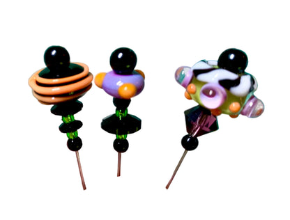 3 Decorative Halloween purple orange black green chacha pins with colorful glass beads on a white background. 
[additional_image_link]