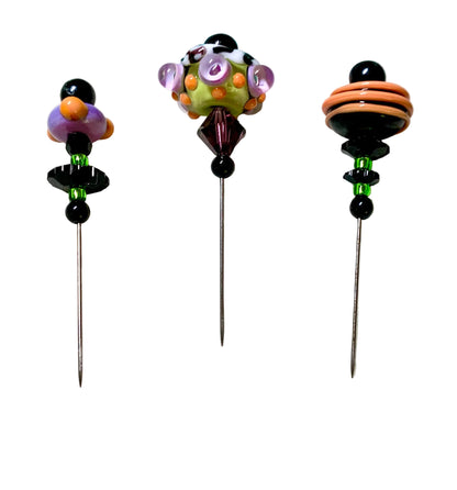 3 Decorative Halloween purple orange black green chacha pins with colorful glass beads on a white background. 
[additional_image_link]
